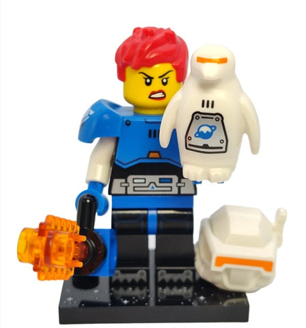 LEGO figure with red hair, blue outfit, and orange weapon on a white background. The figure is holding a white penguin and their helmet is on the floor by their feet.